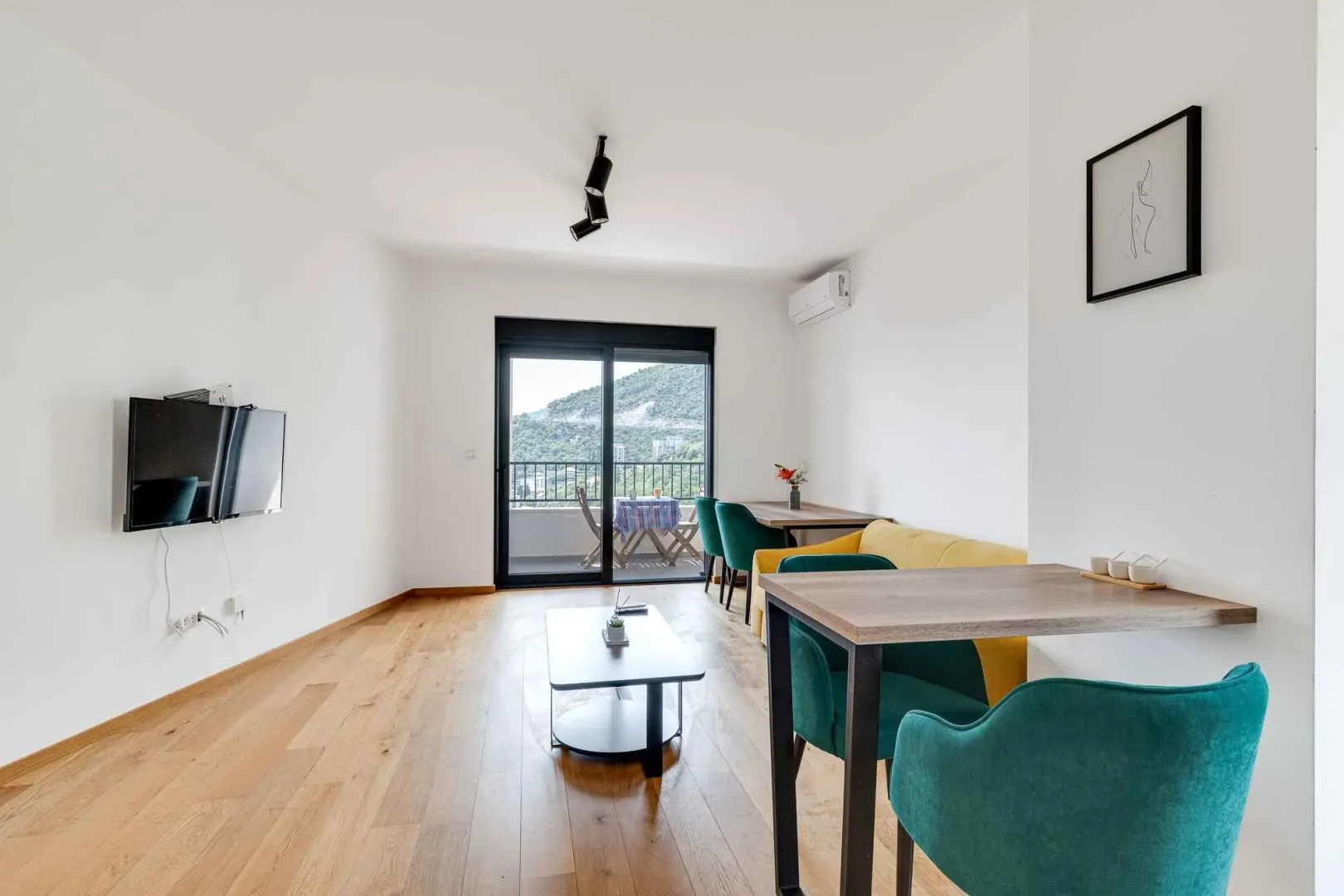 Living room with dining area and terrace access.
