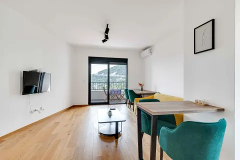 Living room with dining area and terrace access. - image 10