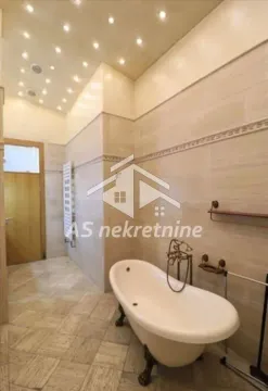 Bathroom tiled in ceramic with a classic clawfoot bathtub. - image 23