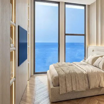 Modern bedroom with a double bed and a sea view through a large window. - image 6
