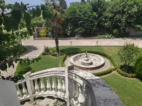 View from the terrace of the landscaped courtyard with a fountain.