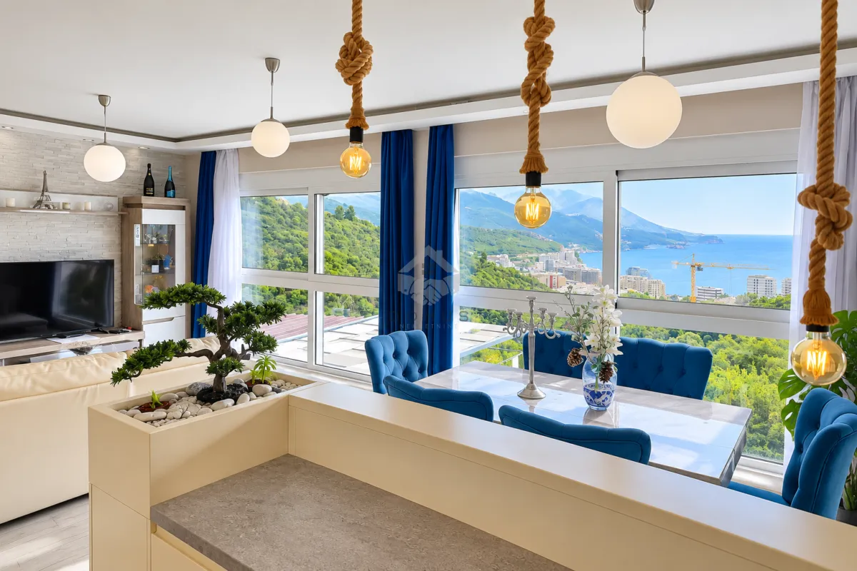Living room with dining area and sea view.