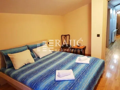 A bedroom with a double bed and blue linens. - image 7