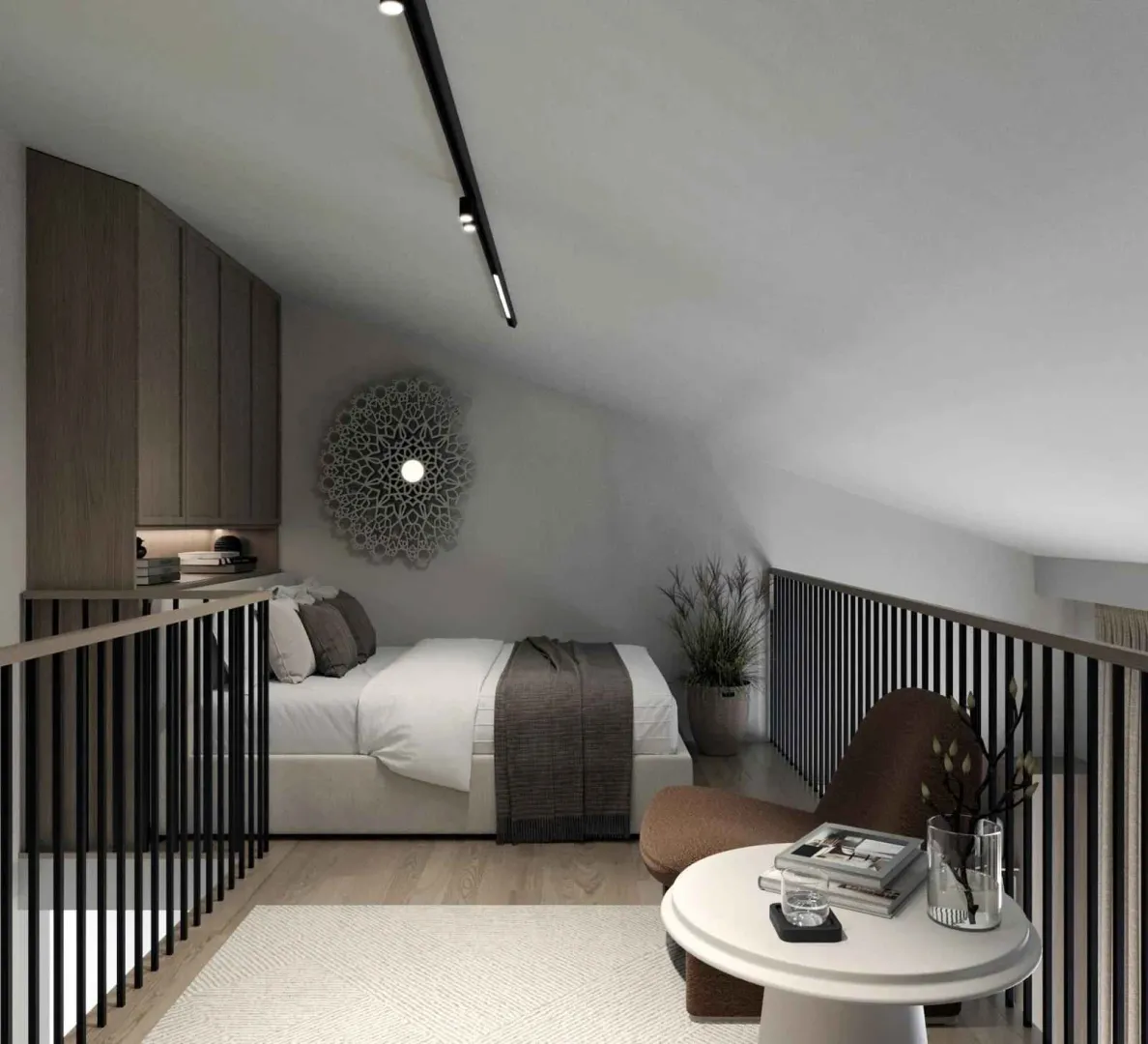 Modern attic bedroom with a double bed and a seating area.