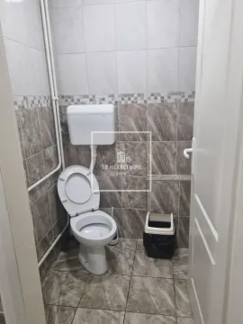 Smaller bathroom with ceramic tiles and sanitary ware. - image 16