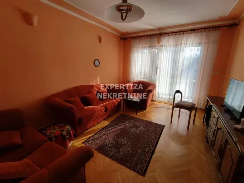 Living room with sofa set and hardwood flooring. - image 12