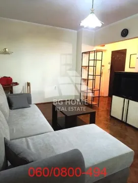Living room with a corner sofa, coffee table and TV unit. - image 2