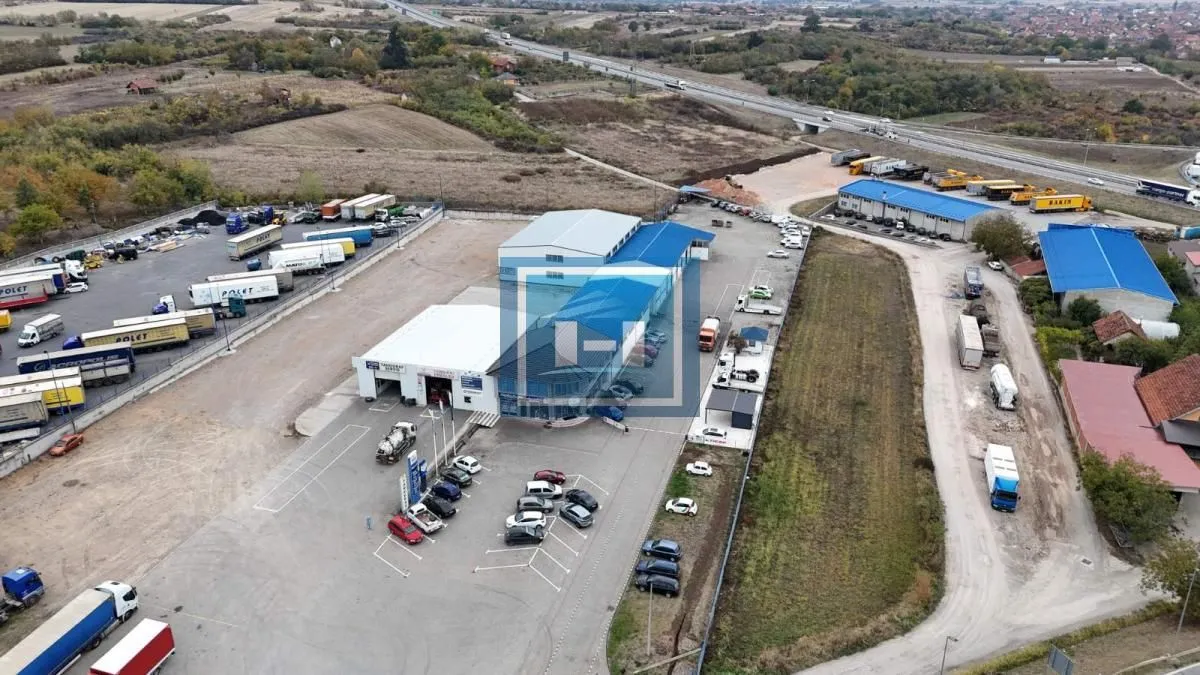 Aerial view of the business complex with warehouses and parking area.