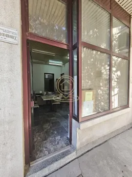 Entrance to the commercial space with a large glass storefront. - image 5