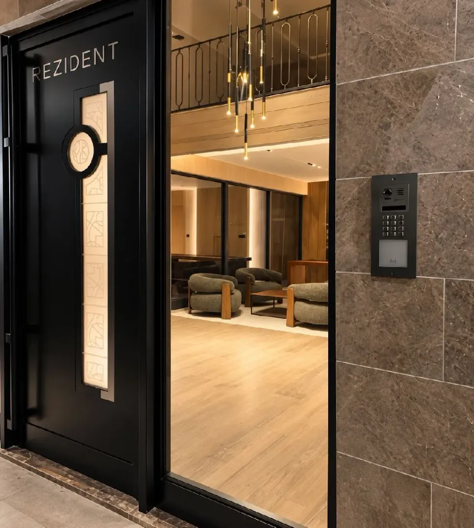 Entrance door and lobby of a modernly equipped residential building.