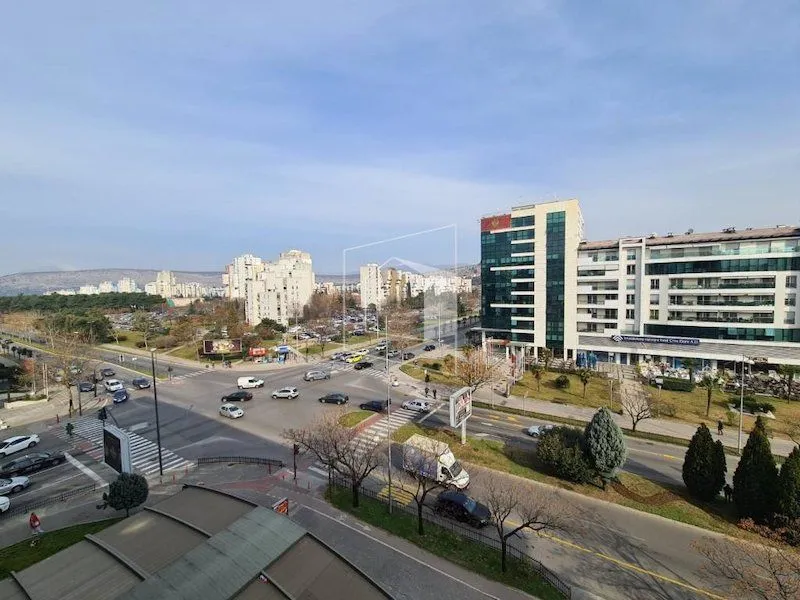 View from the terrace of the city street and surrounding buildings.