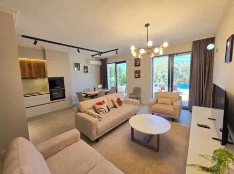 Living room with kitchen and dining area and access to the terrace with a swimming pool. - image 19