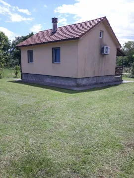 Exterior view of the house with a landscaped yard. - image 4