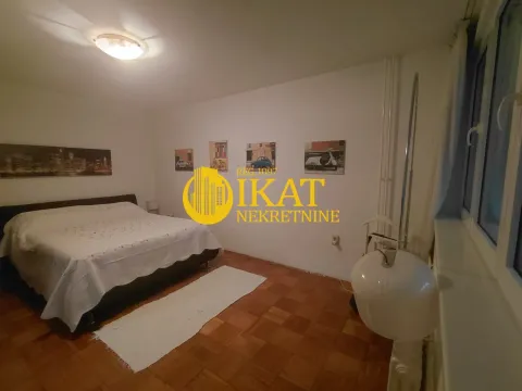 Bedroom with a double bed and parquet flooring. - image 8