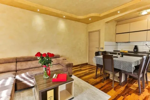 Living room with a sofa set and an adjoining dining area. - image 11