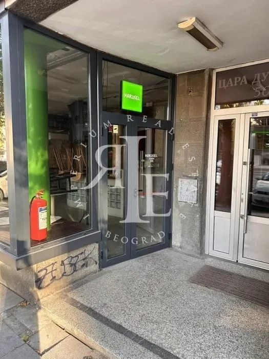 Entrance to the commercial space with a glass storefront.