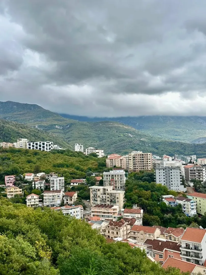 View from the property overlooking the city and mountains in the background.