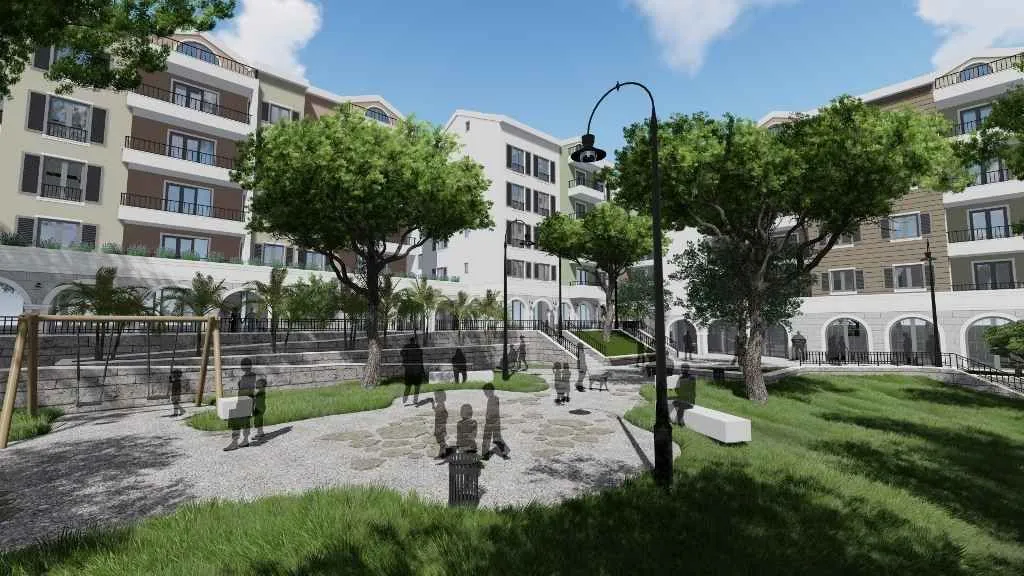 Render dvorišta i kompleksa zgrada sa uređenim zelenilom i igralištem.