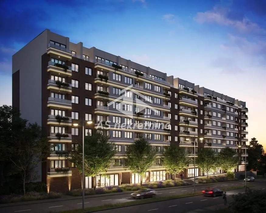 Exterior view of a modern residential building with illumination at dusk.