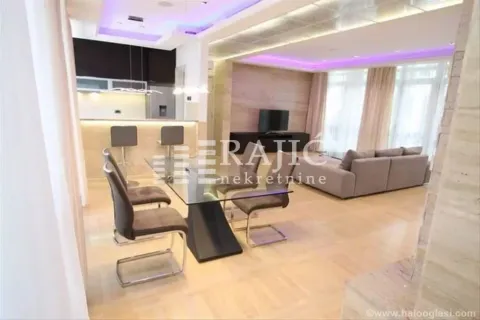 Spacious living room with dining area and modern lighting. - image 15