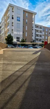 Driveway to the underground garage in front of the residential building. - image 6