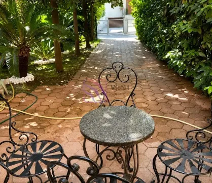 Garden furniture set with a table and chairs in the courtyard of the house. - image 13