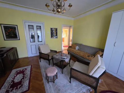 Living room with a sofa, armchairs, and furniture. - image 6
