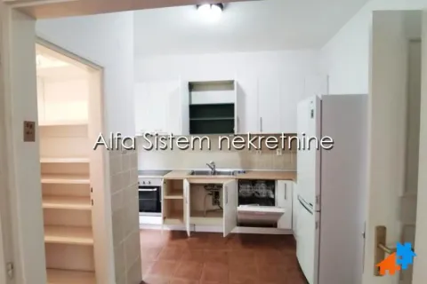 Smaller kitchen with white cabinetry and white appliances. - image 7
