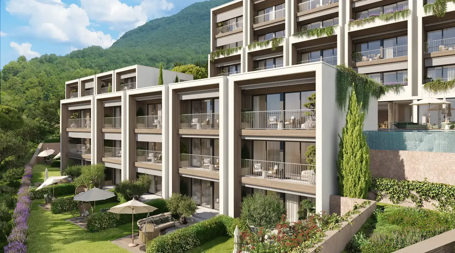 Pogled na spoljašnjost moderne stambene zgrade sa uređenim dvorištem i terasama.