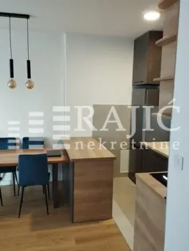 Modern kitchen with dining area in an open space layout. - image 5