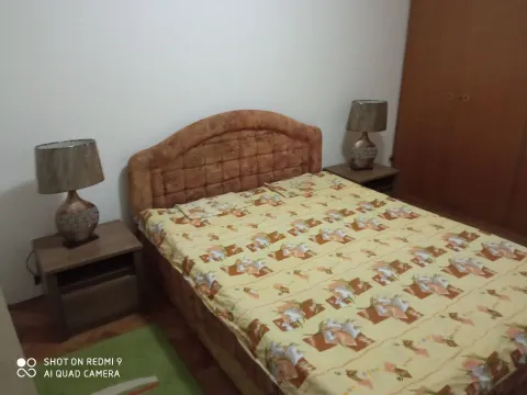 A bedroom featuring a double bed and nightstands. - image 8