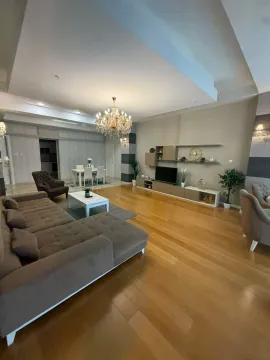 Spacious living room with a sofa set, dining table and wooden flooring. - image 19