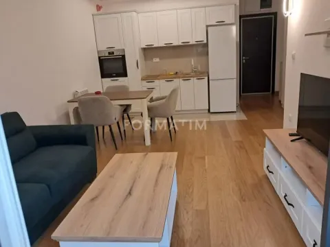 Living room with dining area and kitchen in an open space layout. - image 3
