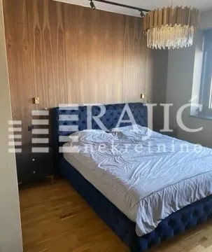 Modern bedroom with a double bed and wooden wall paneling. - image 7