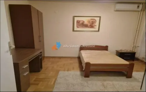 Furnished bedroom with a bed, wardrobe and desk. - image 12