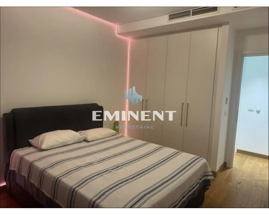 Bedroom with a double bed and a built-in wardrobe.