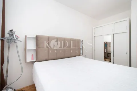 Bedroom with a double bed, upholstered headboard, and a white wardrobe. - image 6
