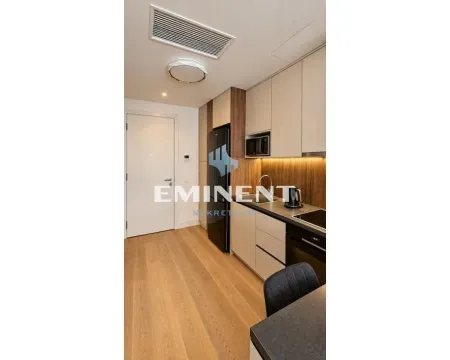 Modern kitchen with built-in appliances and wooden details. - image 7