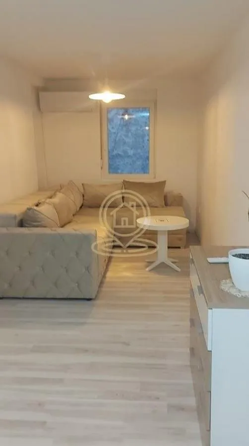 Living room with a sectional sofa and a coffee table.