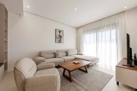 Bright living room with a sofa, armchair and wooden coffee table. - image 6
