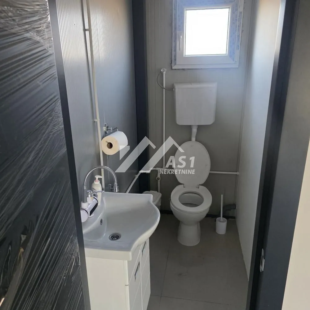 Small bathroom with a sink and a toilet.