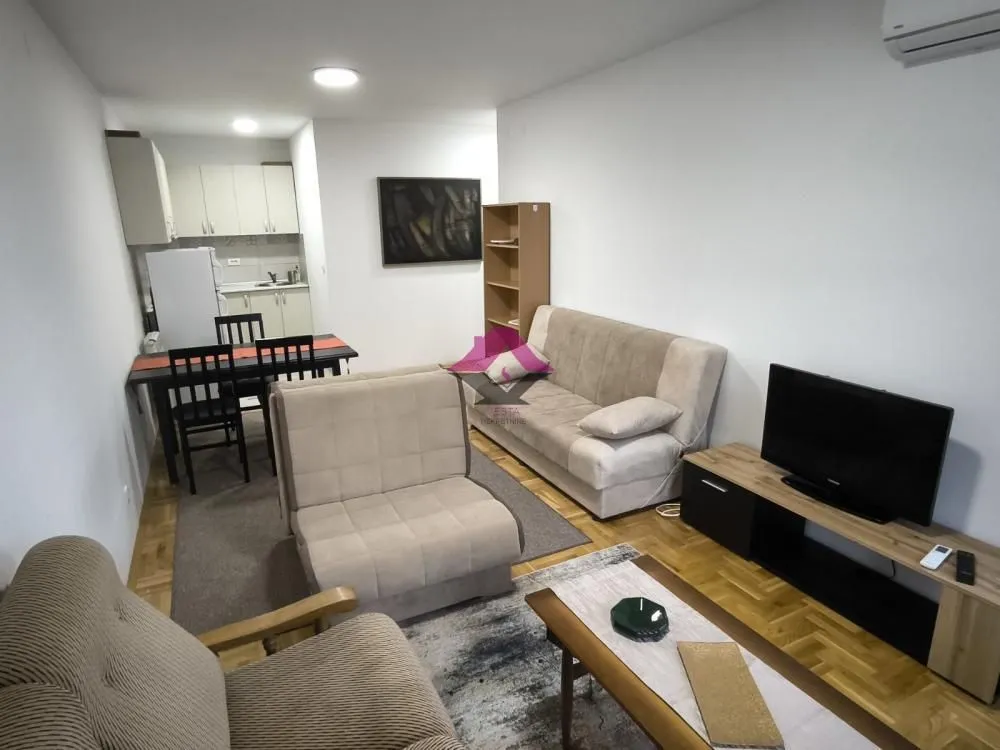 Living room connected to the dining area and kitchen.