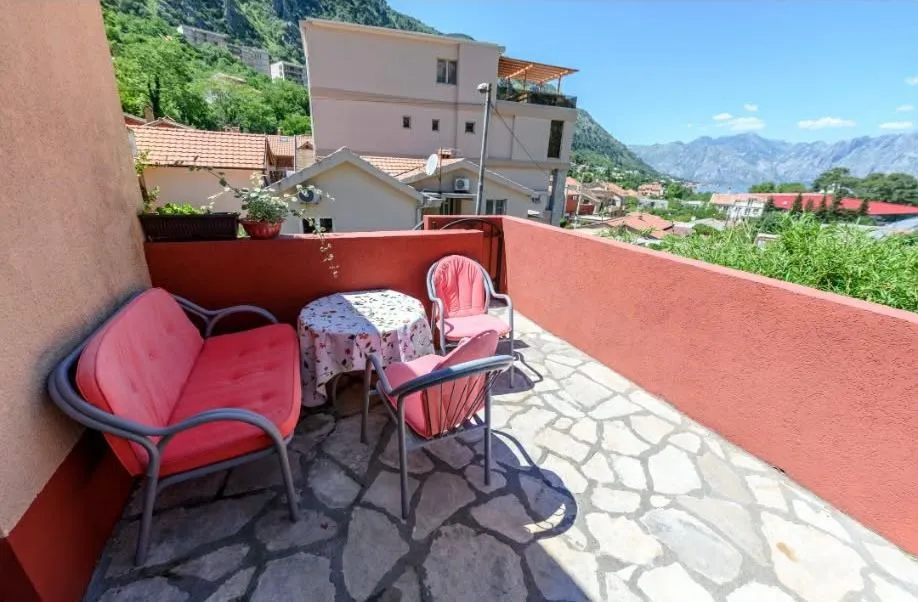 Furnished terrace with seating area and surrounding views.