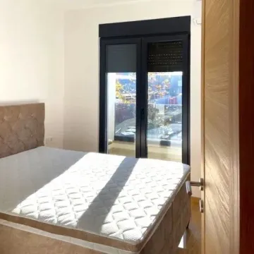 Bedroom with a double bed and access to the terrace. - image 3