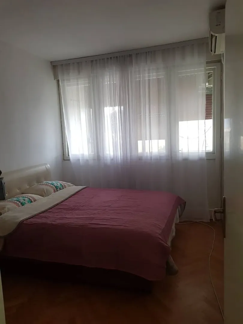 Bright bedroom with a double bed.