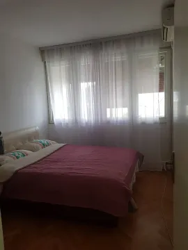 Bright bedroom with a double bed. - image 4