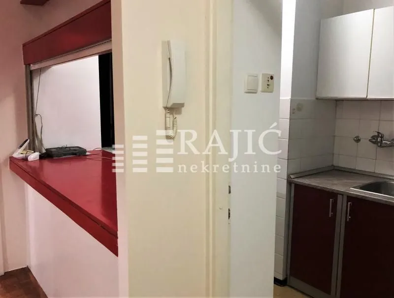 View of the kitchen and counter inside the apartment.