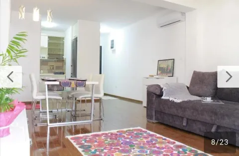 Living room with dining area and kitchen in the background. - image 18