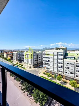 View from the terrace overlooking city streets and surrounding buildings. - image 18