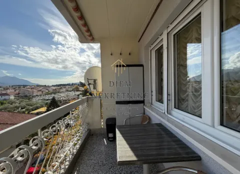 Furnished terrace with a table, chairs, and a view of the surroundings. - image 12